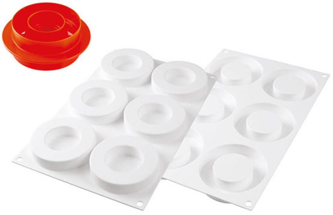 Zwei weiße Tabletts mit Kreisen darauf und einem roten Deckel