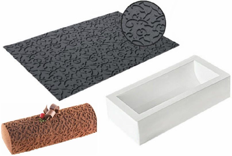 Ein Blatt Papier mit einem Muster darauf neben einem Stück Kuchen