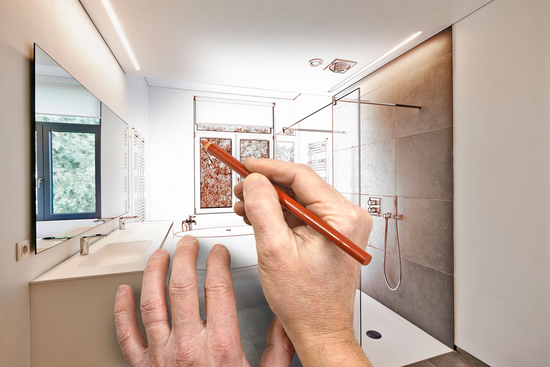 Sur un fond translucide, les mains d'une personne dessinent le plan d'une salle de bains moderne avec un meuble-lavabo et une douche.