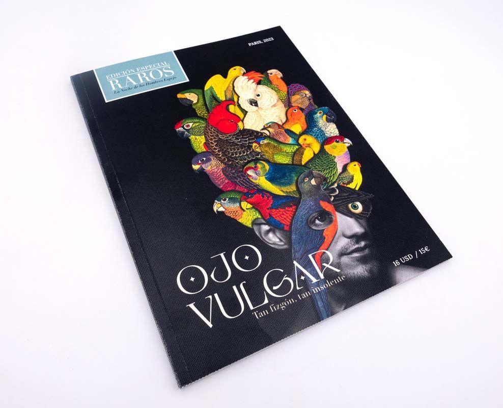 Impression d'un ctalogue Pjo Vulgar avec motif coloré artistique sur fond noir