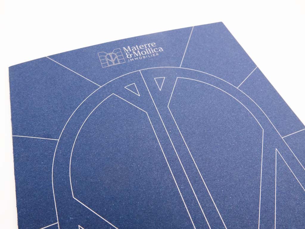 Ouvrage imprimé de l'agence immobilière Materre et Mollica avec une couverture bleue