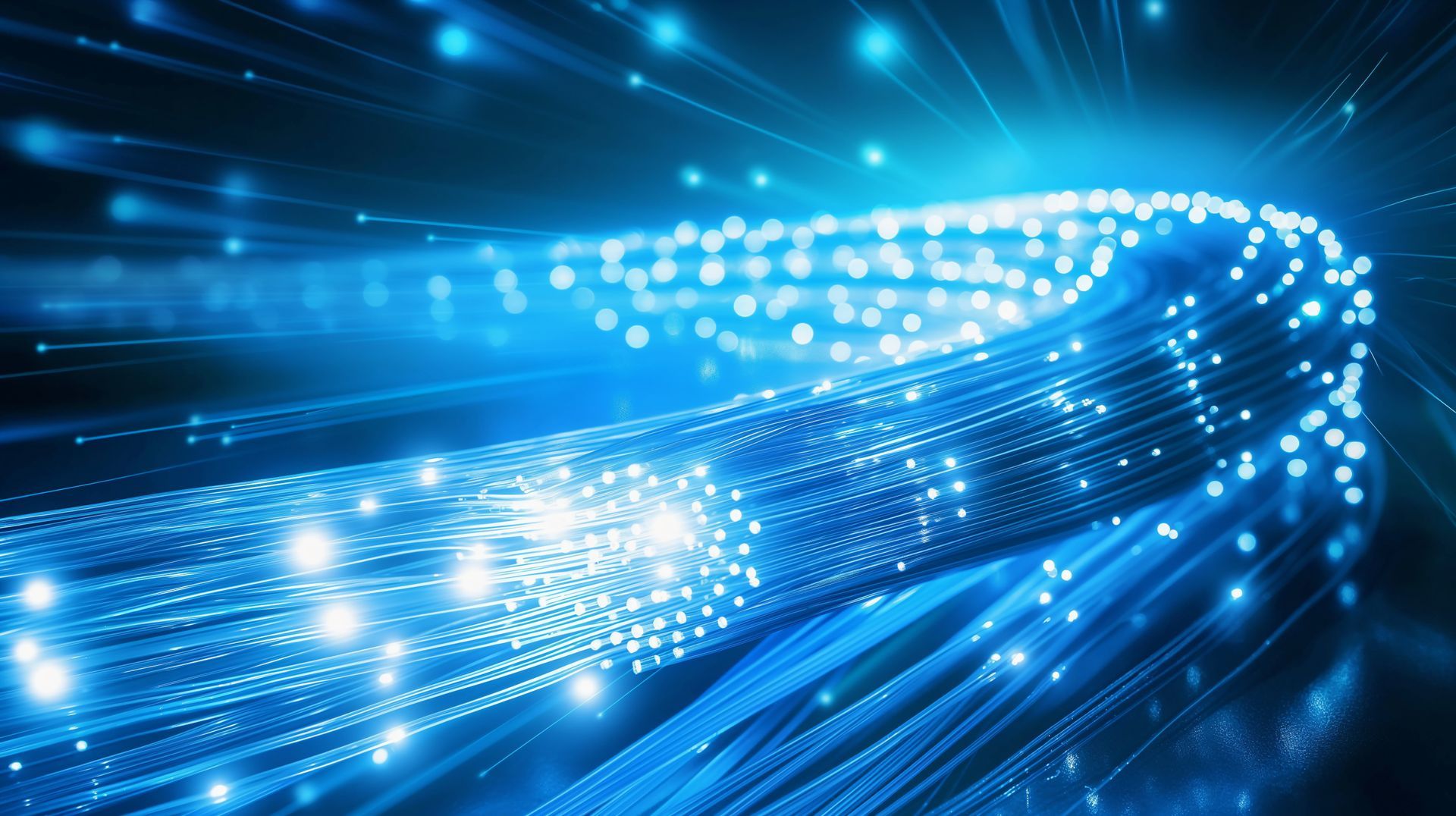 Blaue digitale Netzwerklinien und leuchtende Datenknoten breiten sich vor einem futuristischen Technologiehintergrund aus.