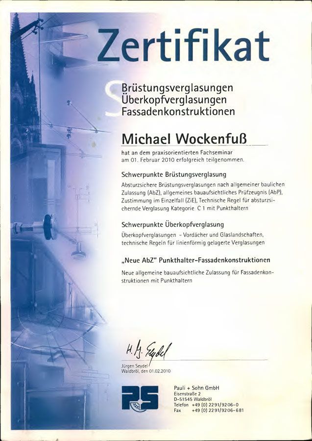 Ein Zertifikat mit der Aufschrift „Zertifikat“ und einem Bild eines Gebäudes darauf.