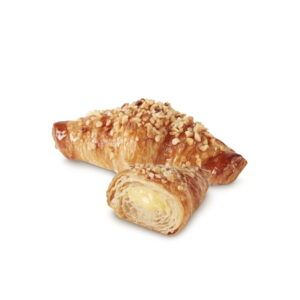 Dois croissants com nozes por cima em um fundo branco.
