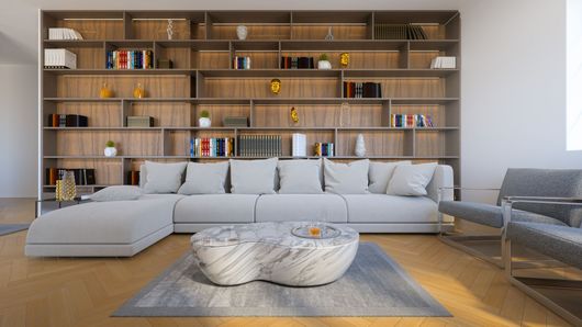 Salon moderne avec canapé d'angle gris, étagère murale en bois et table basse ronde sur tapis.