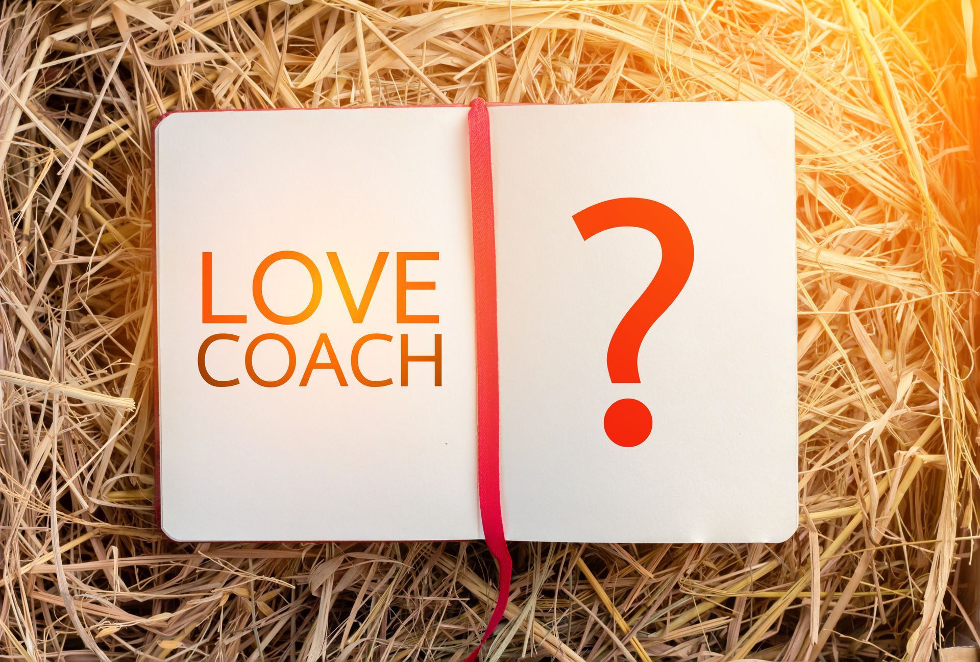 Carnet où il est écrit love coach avec un point d'interrogation - Sonia Bahouth psychologue, Cabinet Sagita
