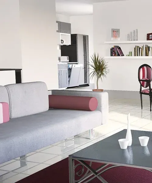 Un canapé gris et bordeaux dans un salon