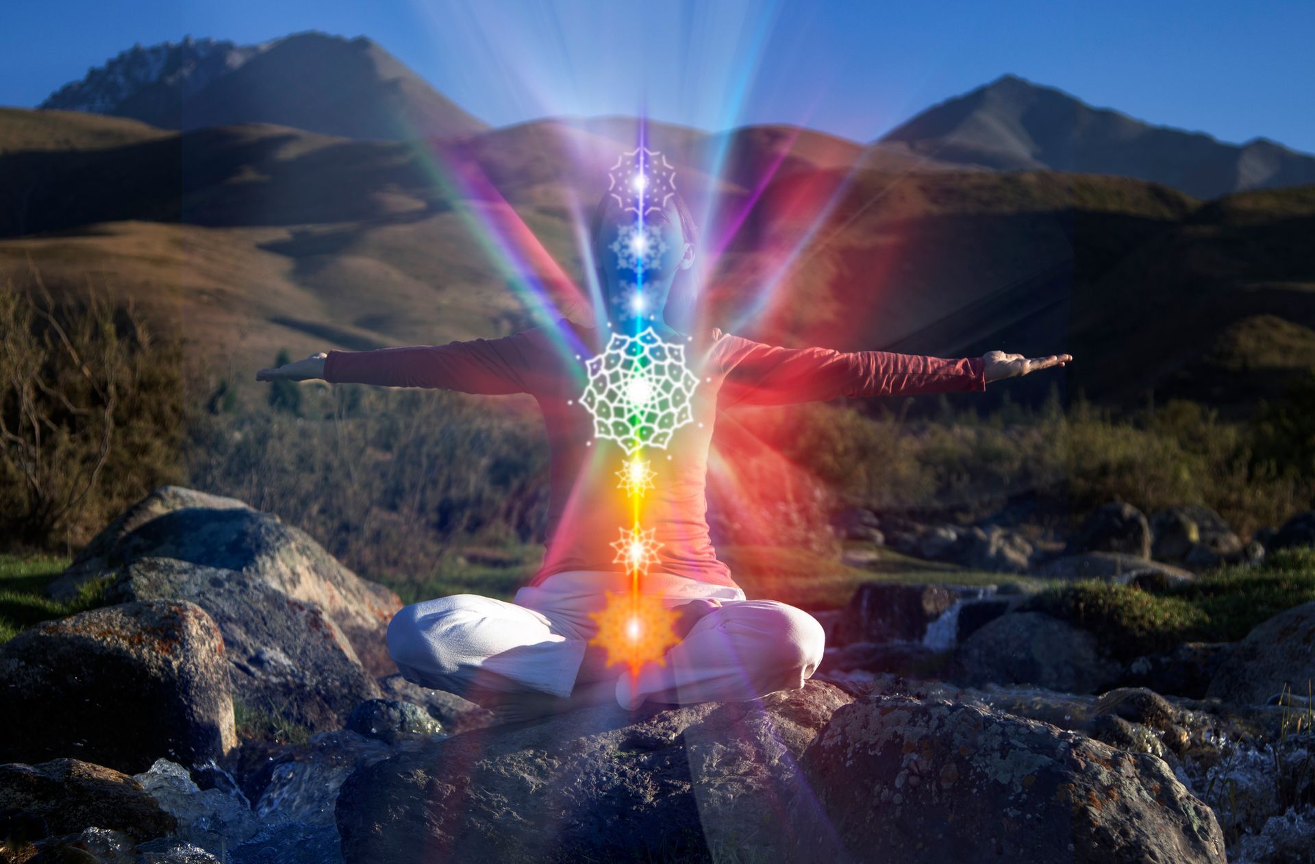 Personne méditant en plein air avec des symboles de chakras lumineux.