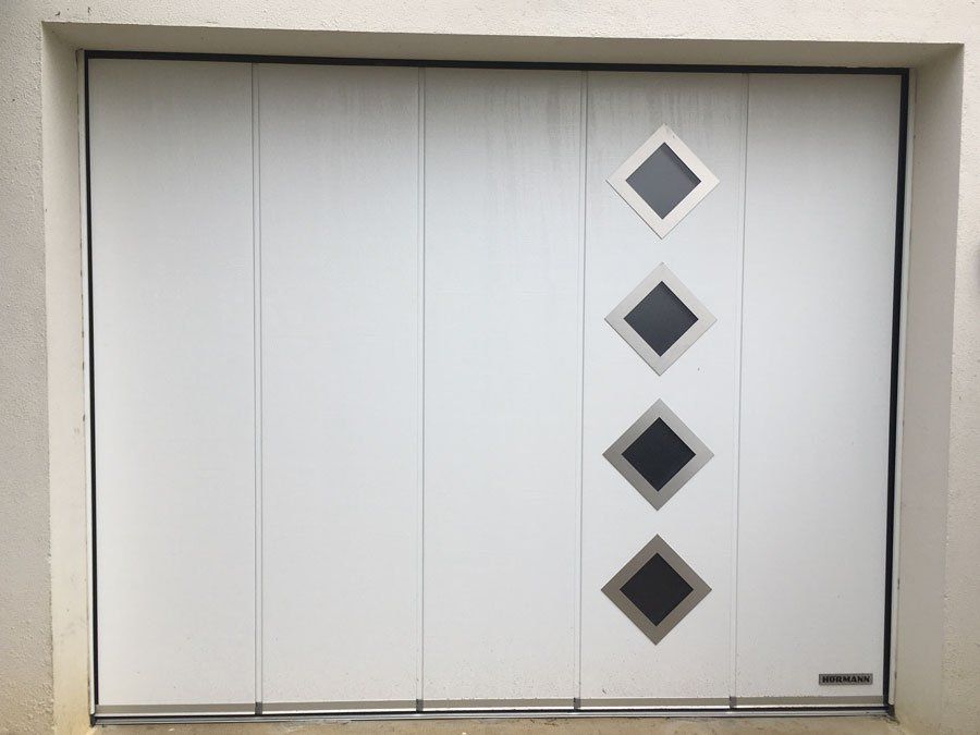 Porte de garage 4 sectionnelle latérale