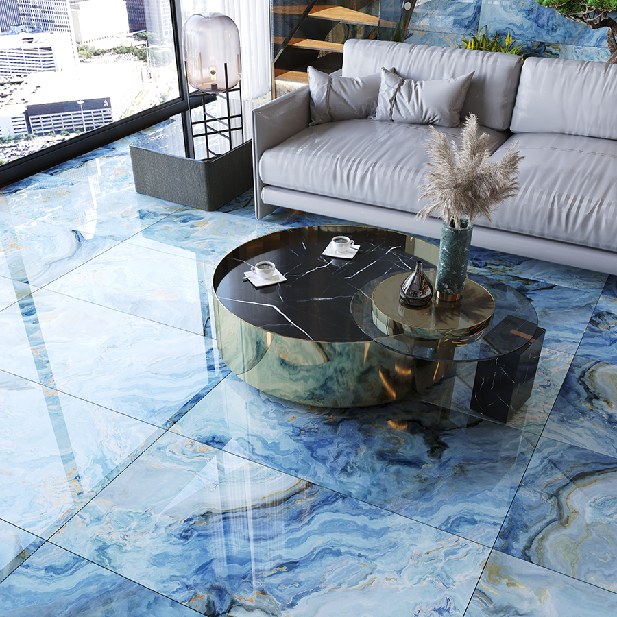 Modernes Wohnzimmer mit grauem Sofa, glänzendem blauem Marmorboden und rundem Glas-Couchtisch mit Vase.