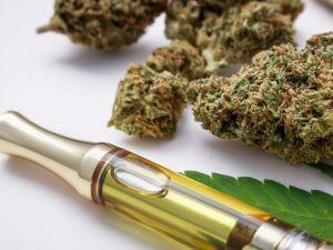 une vape et une fleur de cbd sur un table