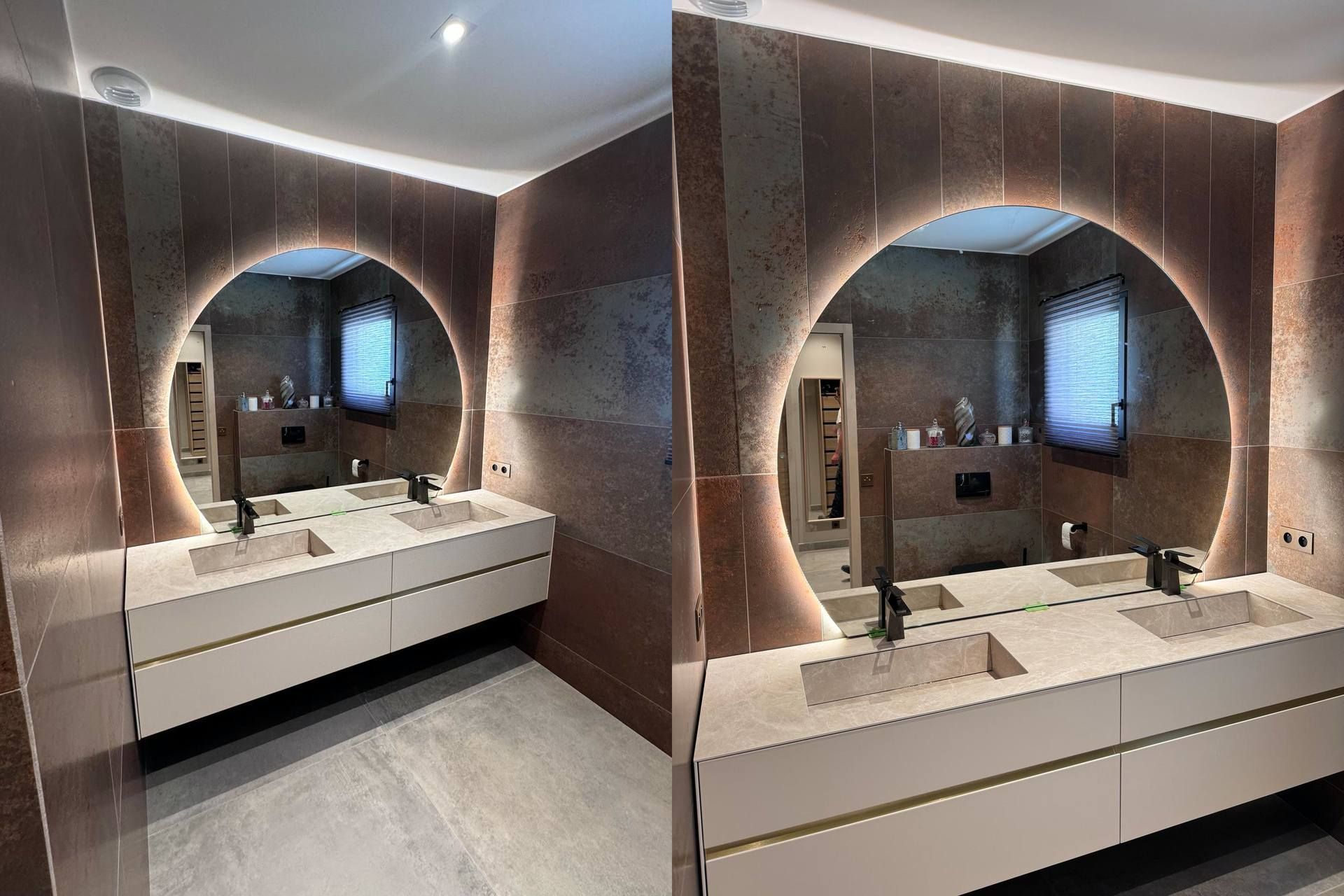 Salle de bain moderne avec un miroir rond éclairé au-dessus d'une double vasque.