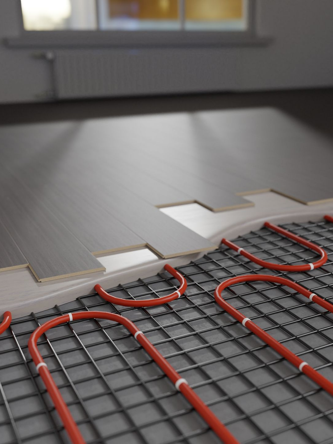 Installation d'un système de chauffage au sol radiant.