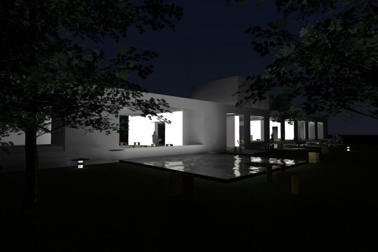 Una casa está iluminada por la noche con árboles en primer plano.