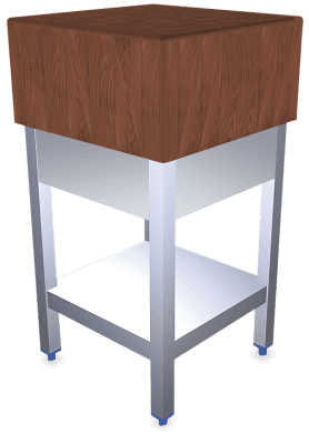 Un bloque de madera se encuentra sobre una mesa de acero inoxidable.