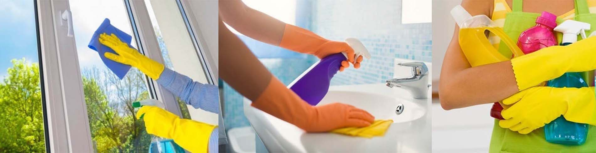 Una mujer que lleva guantes amarillos está limpiando una ventana y un lavabo.