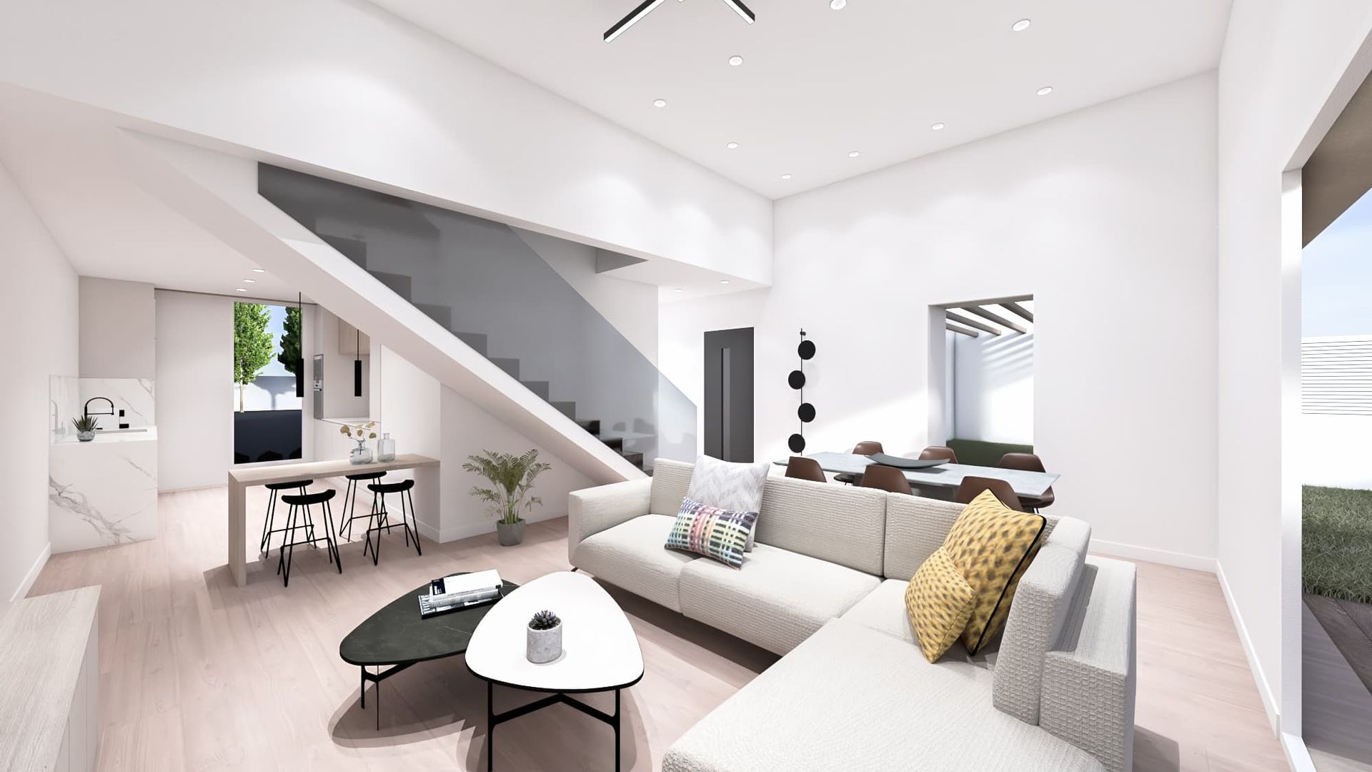 Interior de sala de estar moderna con paredes blancas, escalera y sofá seccional.