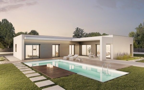 Moderna casa blanca con piscina, tumbonas y césped verde.