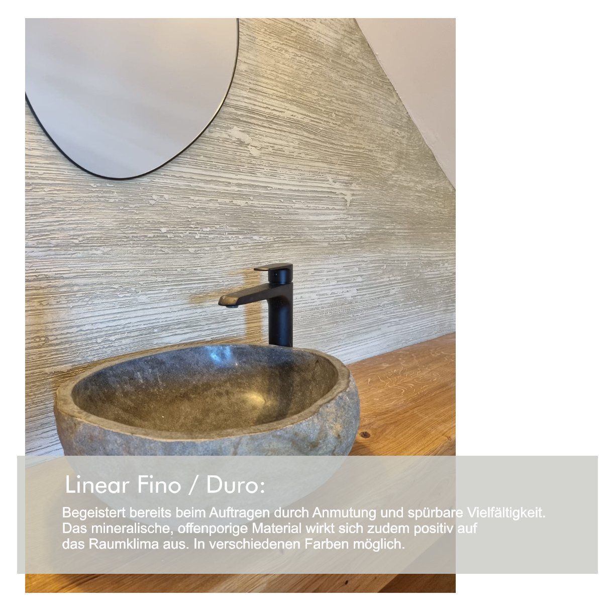 Rundes Waschbecken aus Naturstein auf einem Naturholzschrank und rundem Spiegel