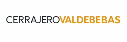 Logotipo de CERRAJERO VALDEBEBAS con texto negro y dorado sobre fondo blanco