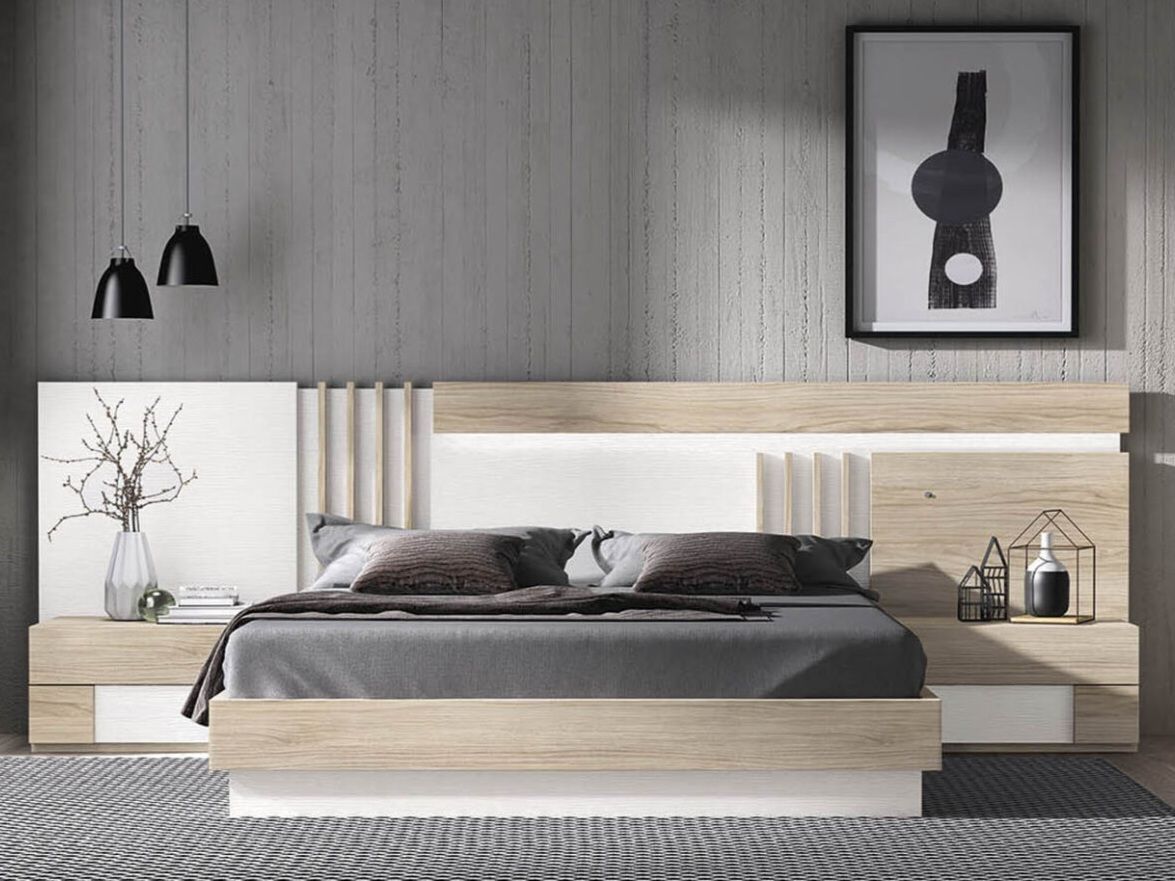 Un dormitorio con una cama, mesitas de noche, tocador, espejo y almohadas moradas.