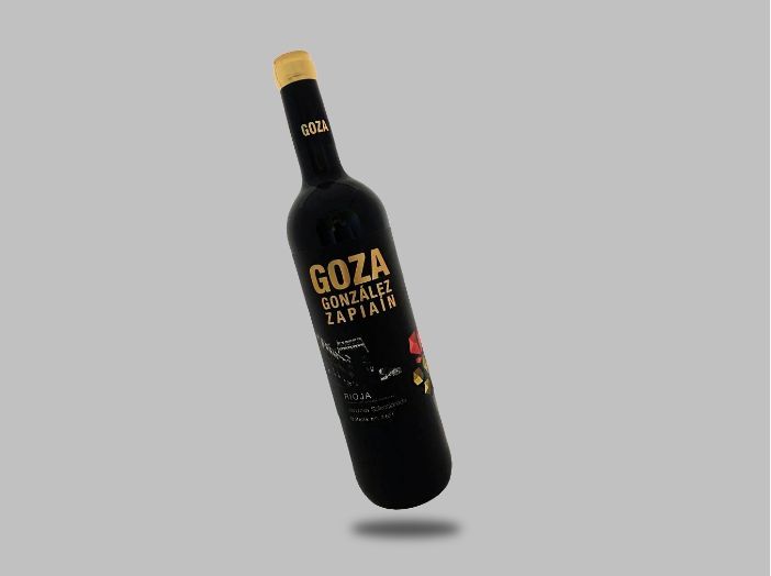 Una botella de vino goza flota en el aire.