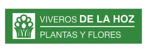 A green sign that says vivero de la hoz plantas y flores