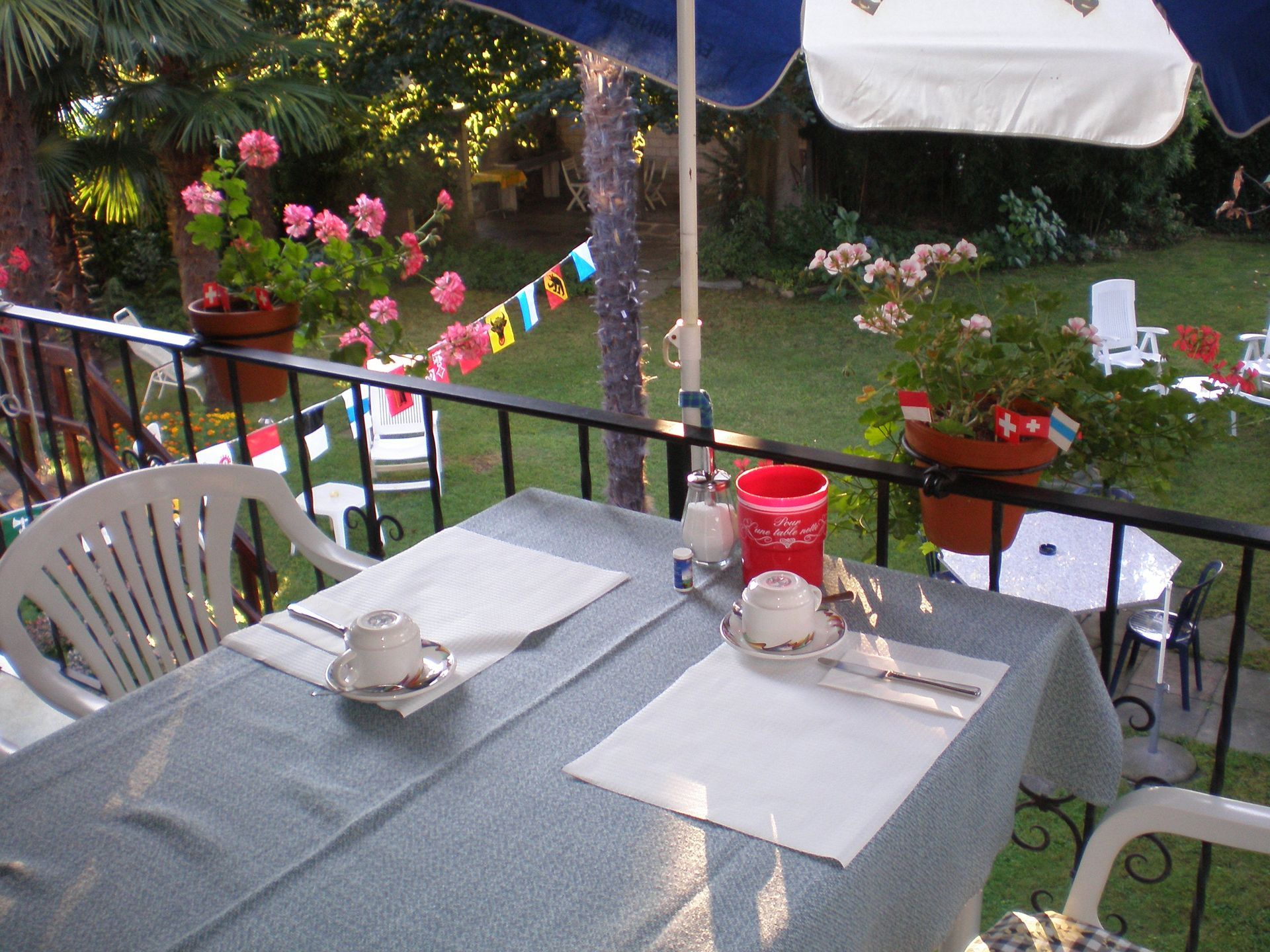 A bedroom with a bed and a rug on the floor