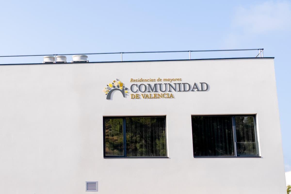 White building with a sign that reads