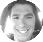 Smiling person in a circular black-and-white profile photo.