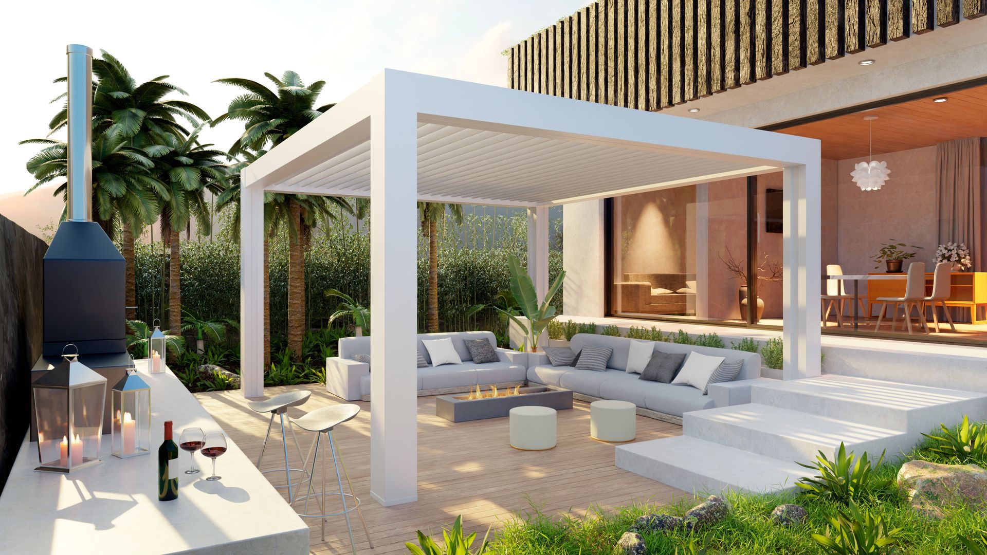 Terrasse luxueuse et moderne avec pergola blanche, canapé d'angle gris, foyer extérieur et aménagement paysager tropical.