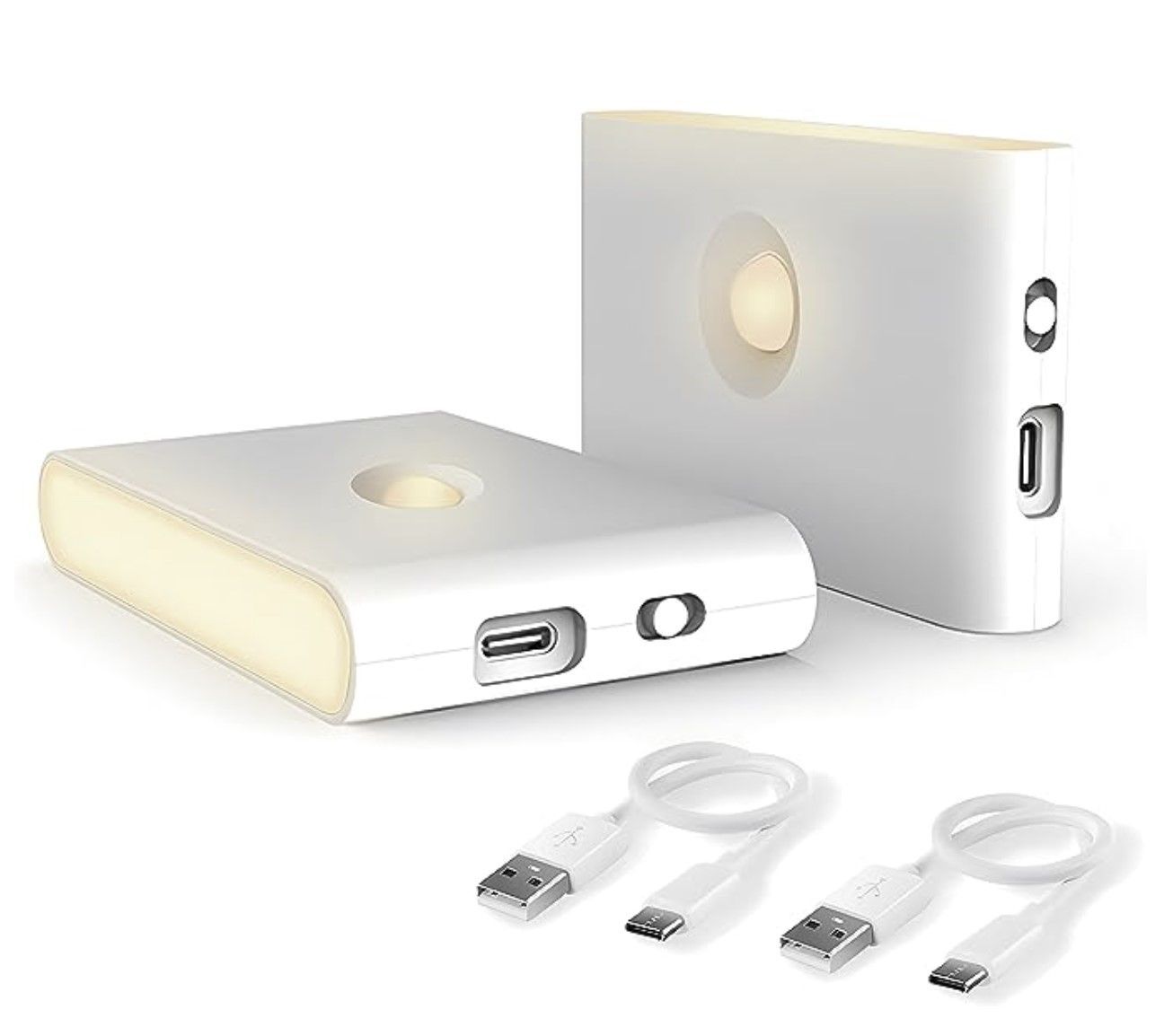 Una caja blanca con una luz dentro y tres cables USB.