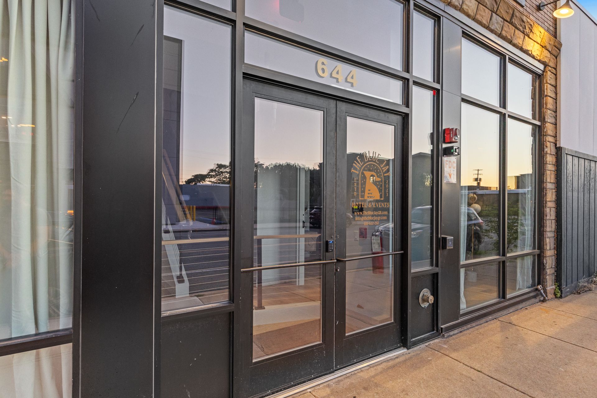 A large building with a lot of windows and doors.