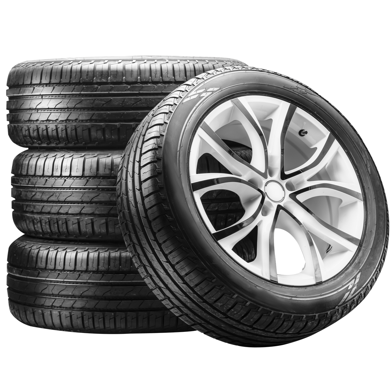 Trois pneus noirs empilés derrière un pneu unique.