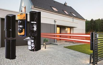 Barrière infrarouge placée à l'entrée d'un jardin