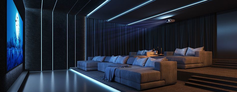 Salle de cinéma équipée de canapés de salon