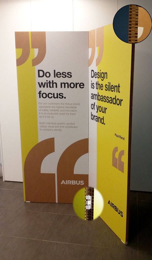 Panneaux publicitaires à motifs jaunes et bruns, portant le texte Faites moins, concentrez-vous davantage.