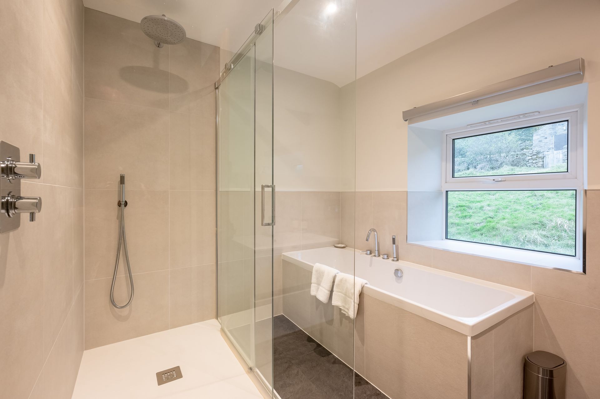 Modern bathroom with walk in shower and bath 