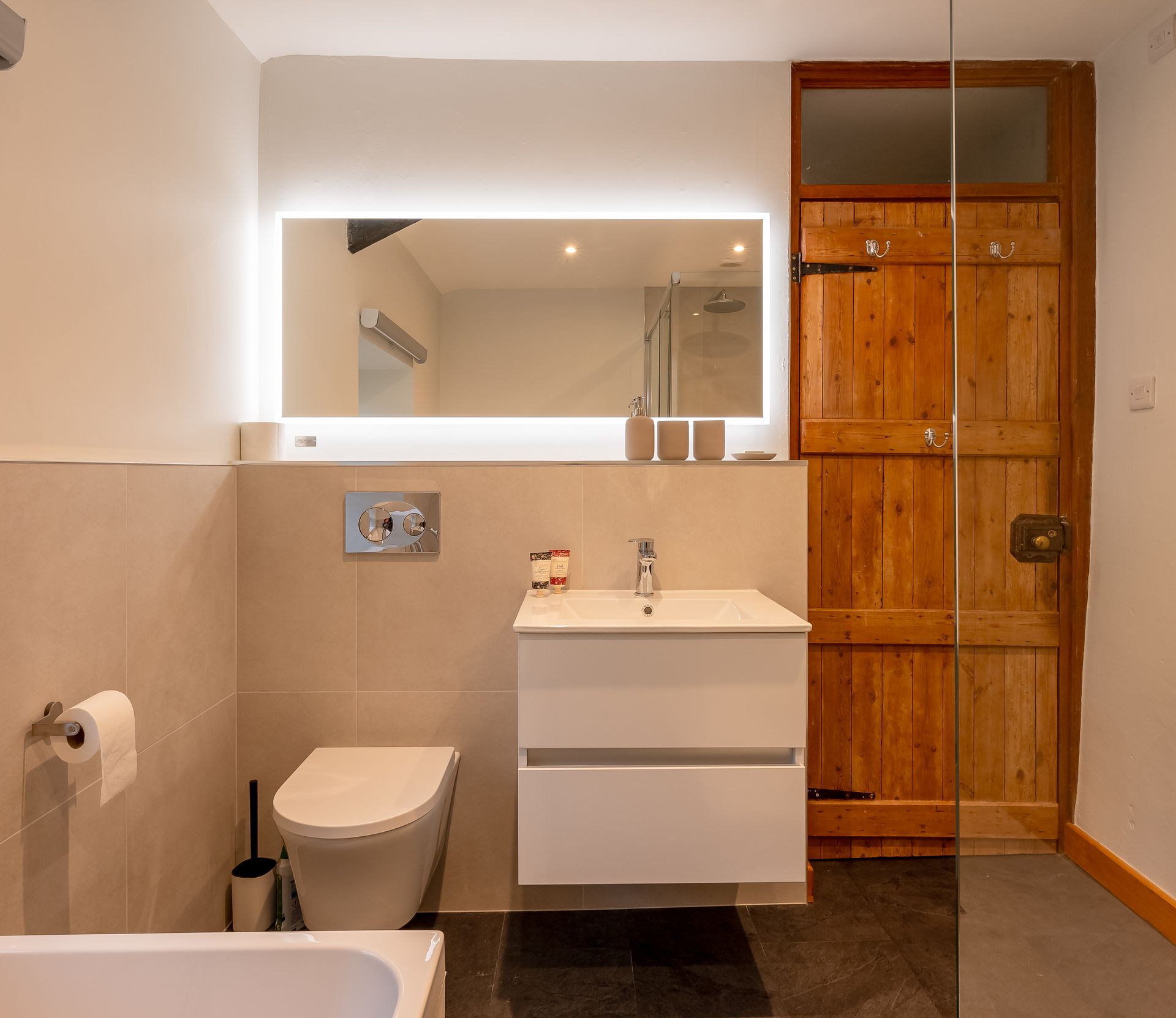 Modern bathroom with illuminiated vanity mirror 