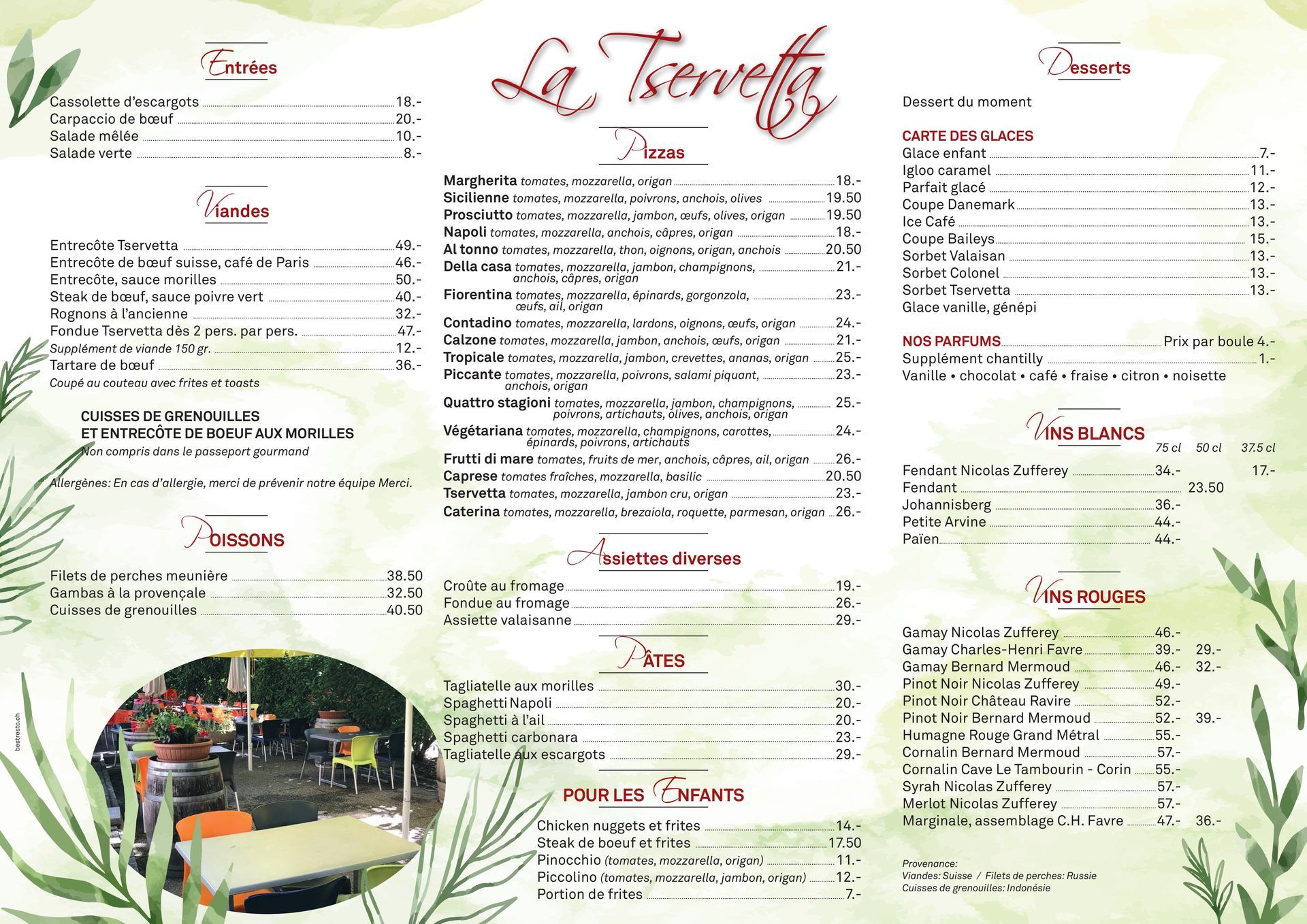 Menu de restaurant avec bordure verte florale, sections de texte et une petite photo de la salle à manger.