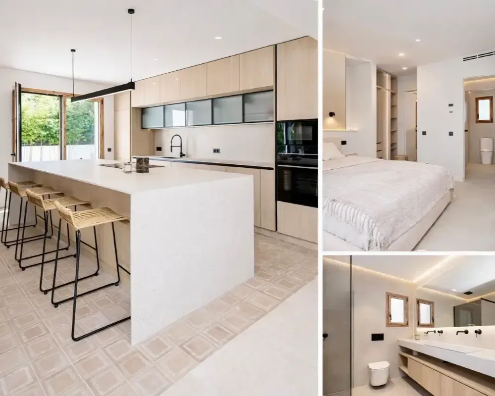Suite moderna de planta abierta con cocina integrada y dormitorio, acabados en blanco y detalles en madera clara.