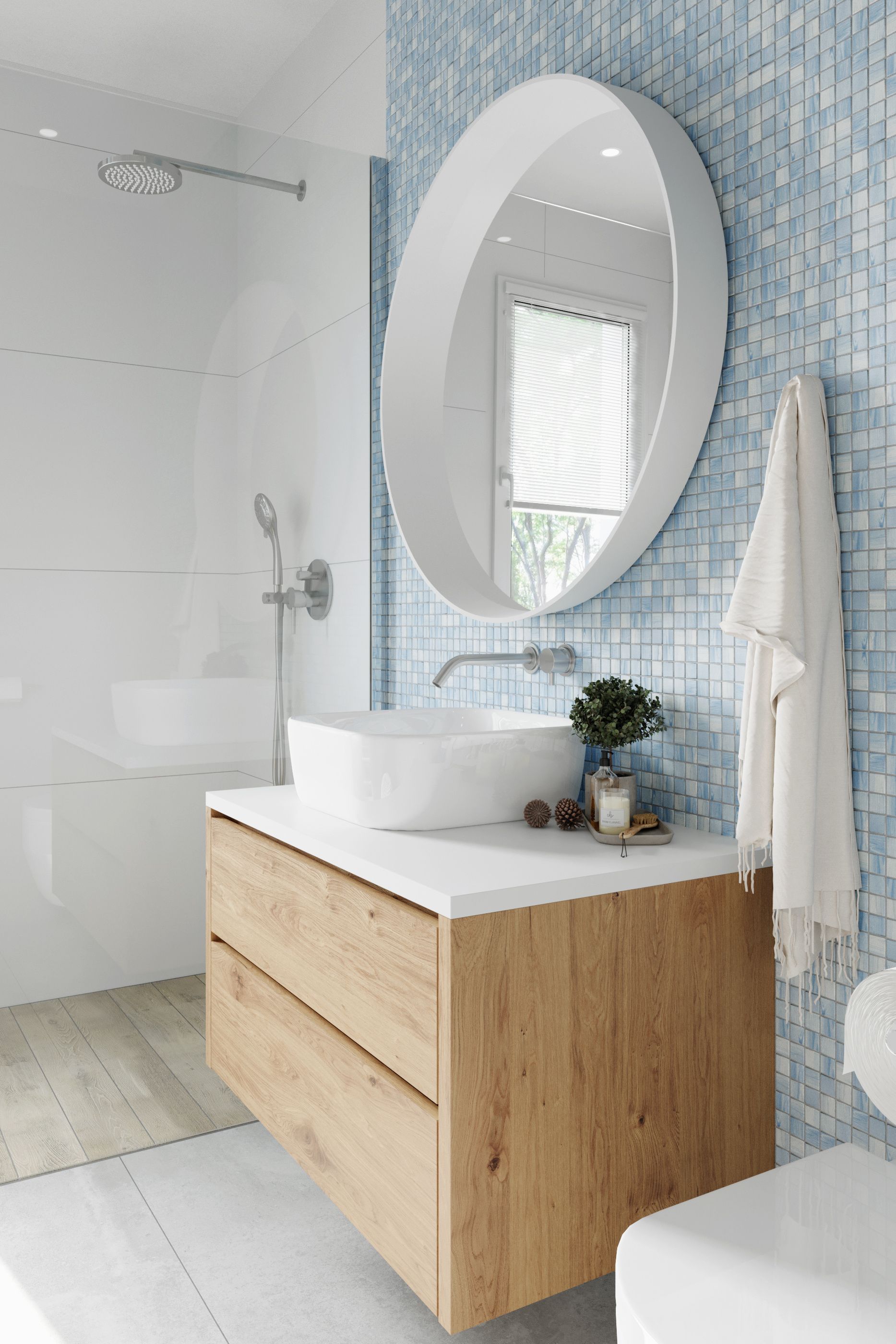 Salle de bains moderne avec meuble-lavabo en bois, miroir rond, lavabo blanc et mur d'accent en mosaïque bleue.