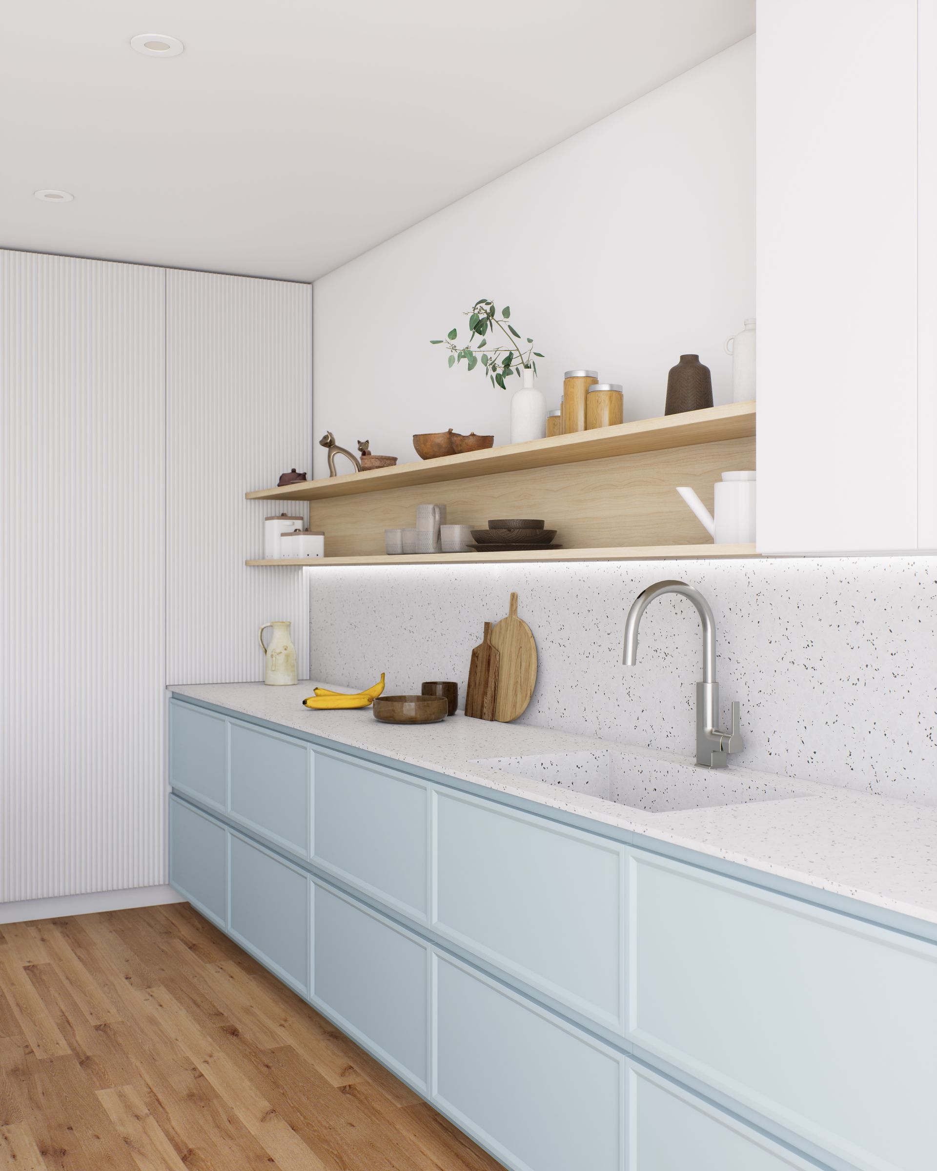 Cuisine moderne et lumineuse avec placards bleu pâle, plan de travail blanc moucheté, étagères en bois et parquet clair