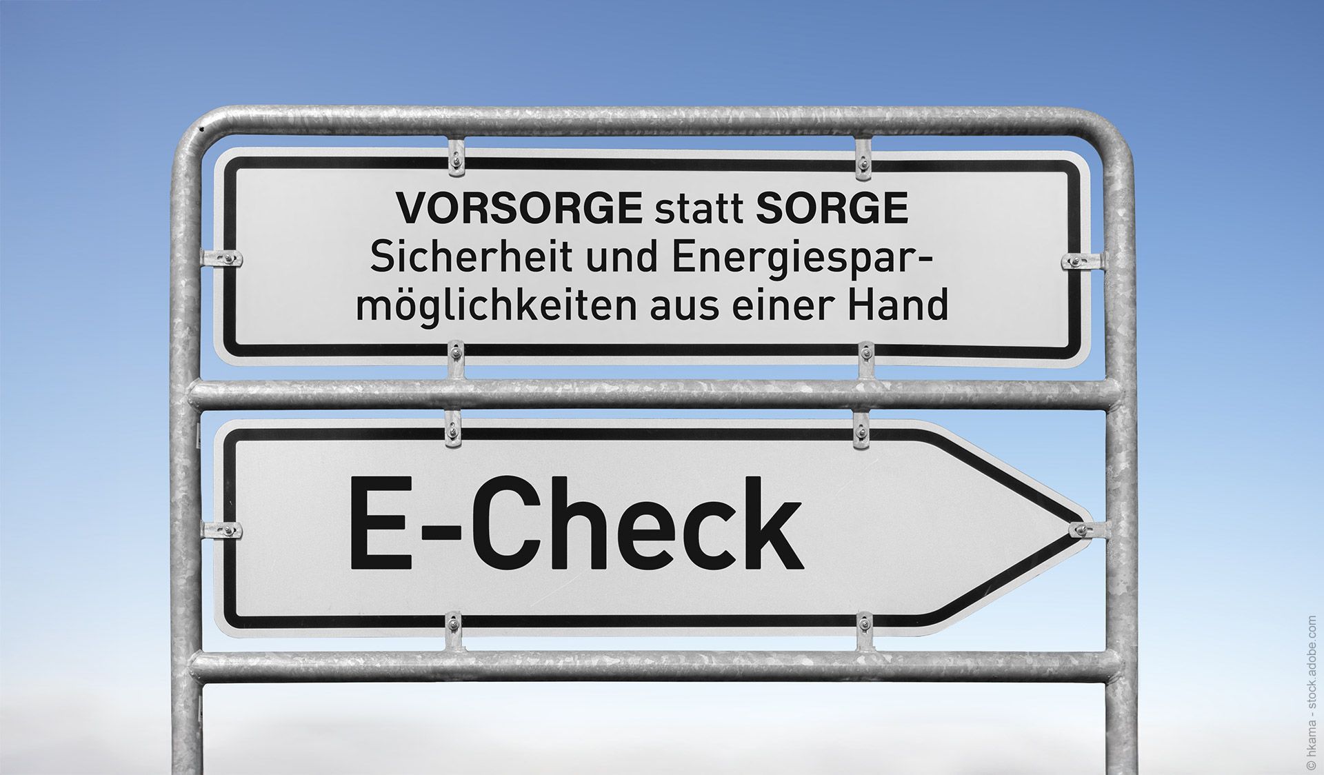 Hinweisschild mit der Aufschrift „Vorsorge statt Sorge“ über „E-Check“, das auf Sicherheit und Energieeinsparung hinweist.