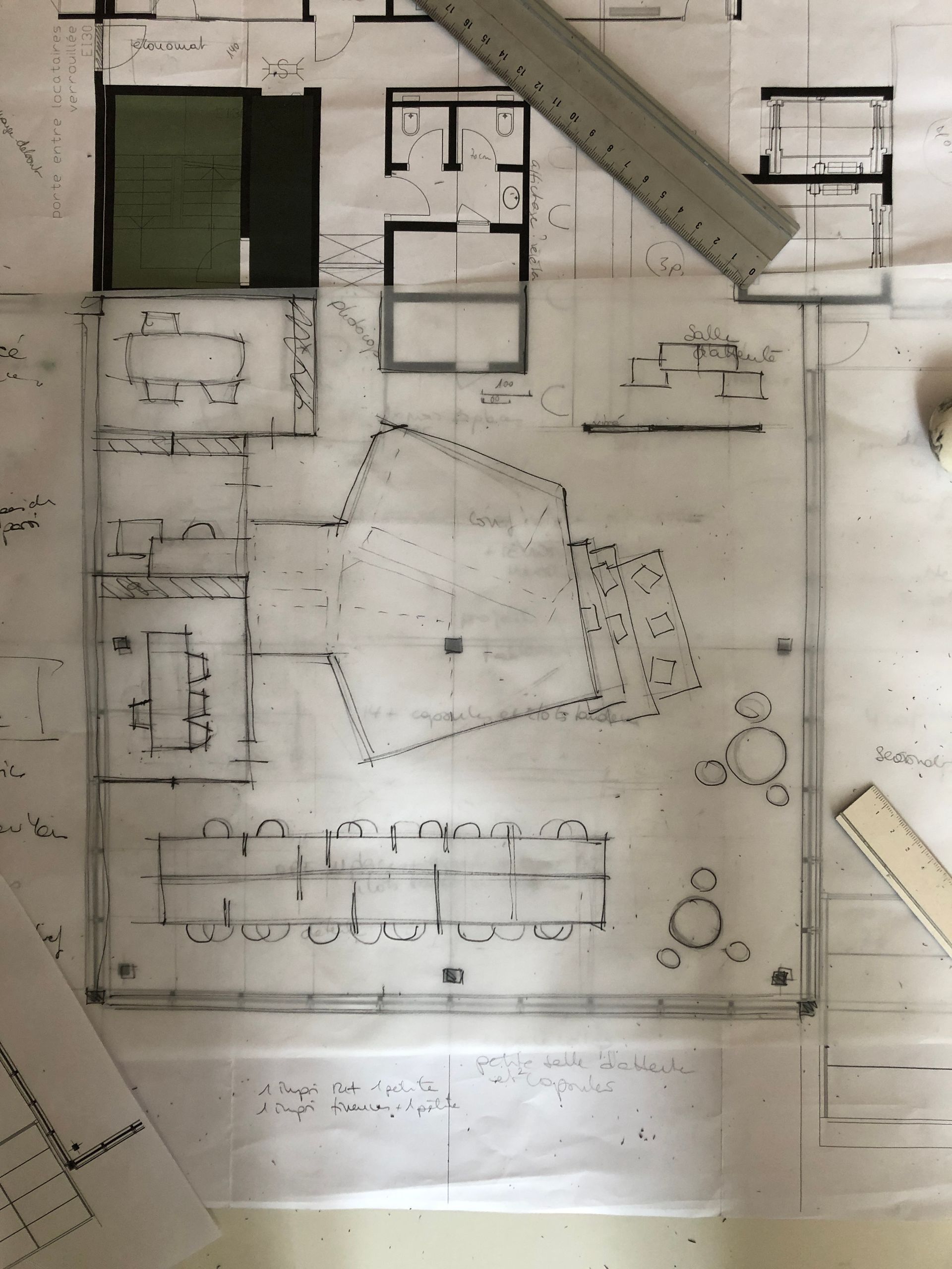 A black and white drawing of a house with a ruler
