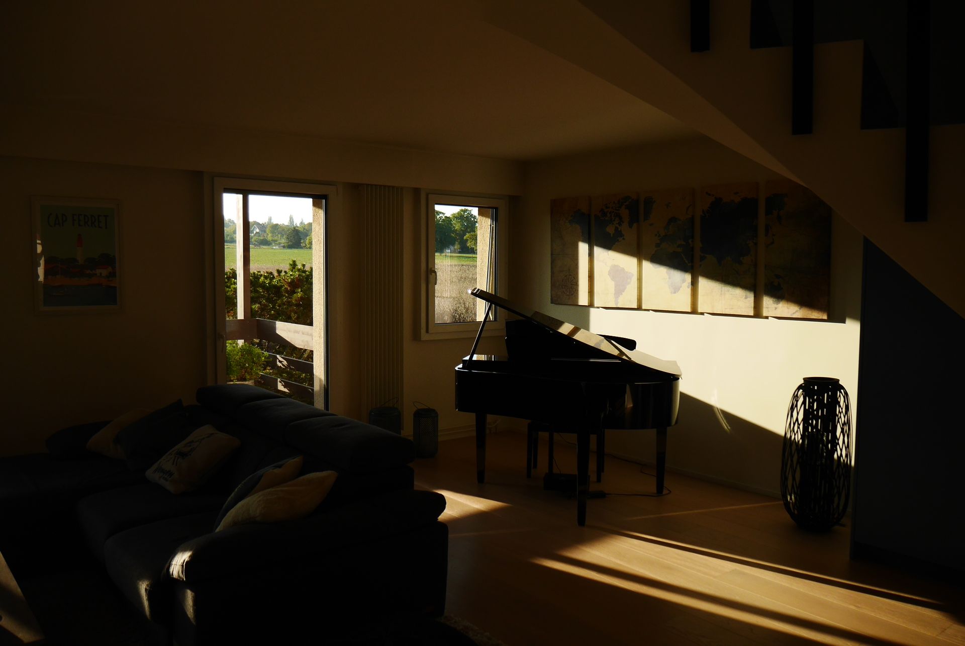 A living room with a piano and a couch