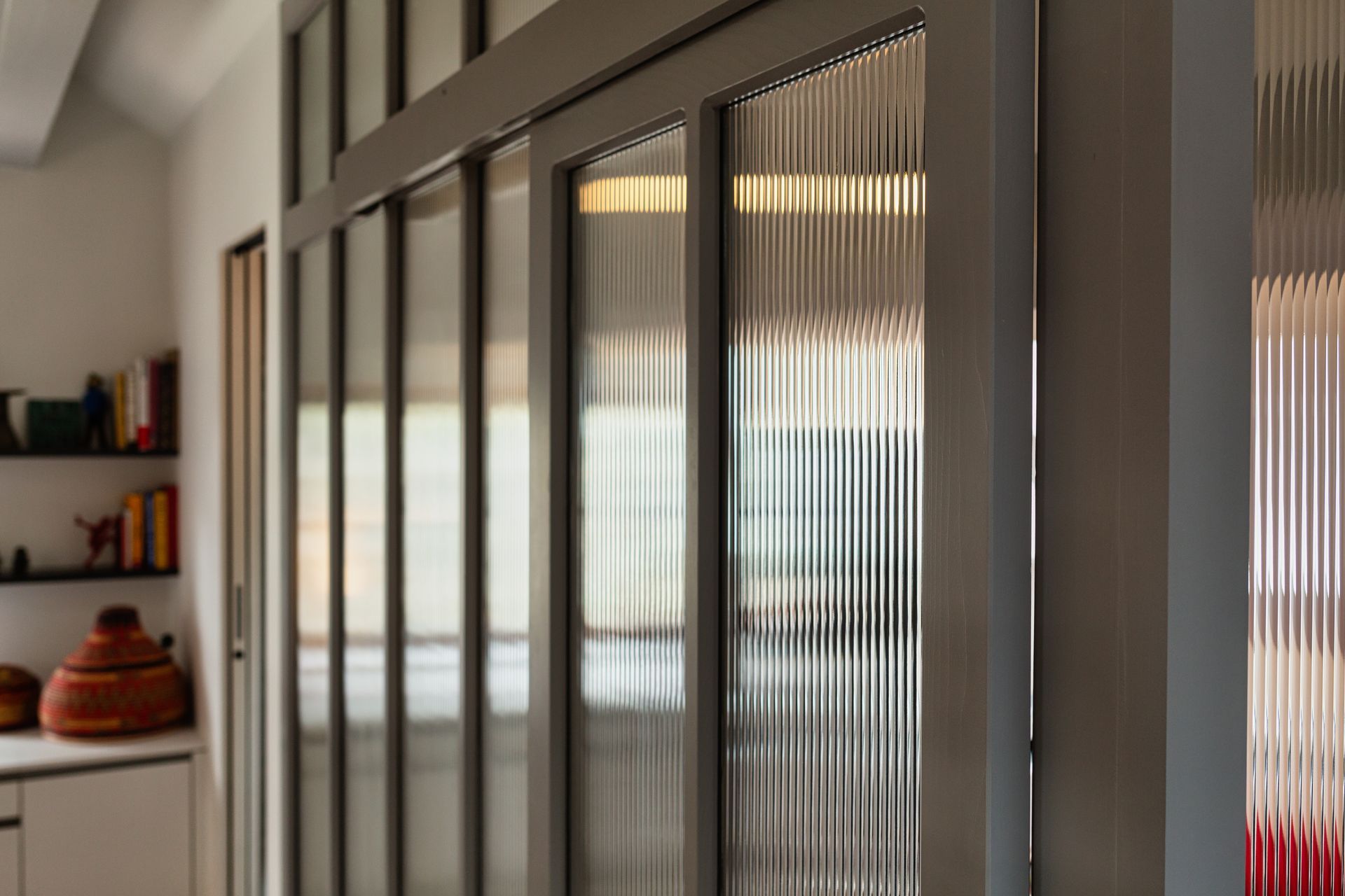 A close up of a sliding glass door in a room.