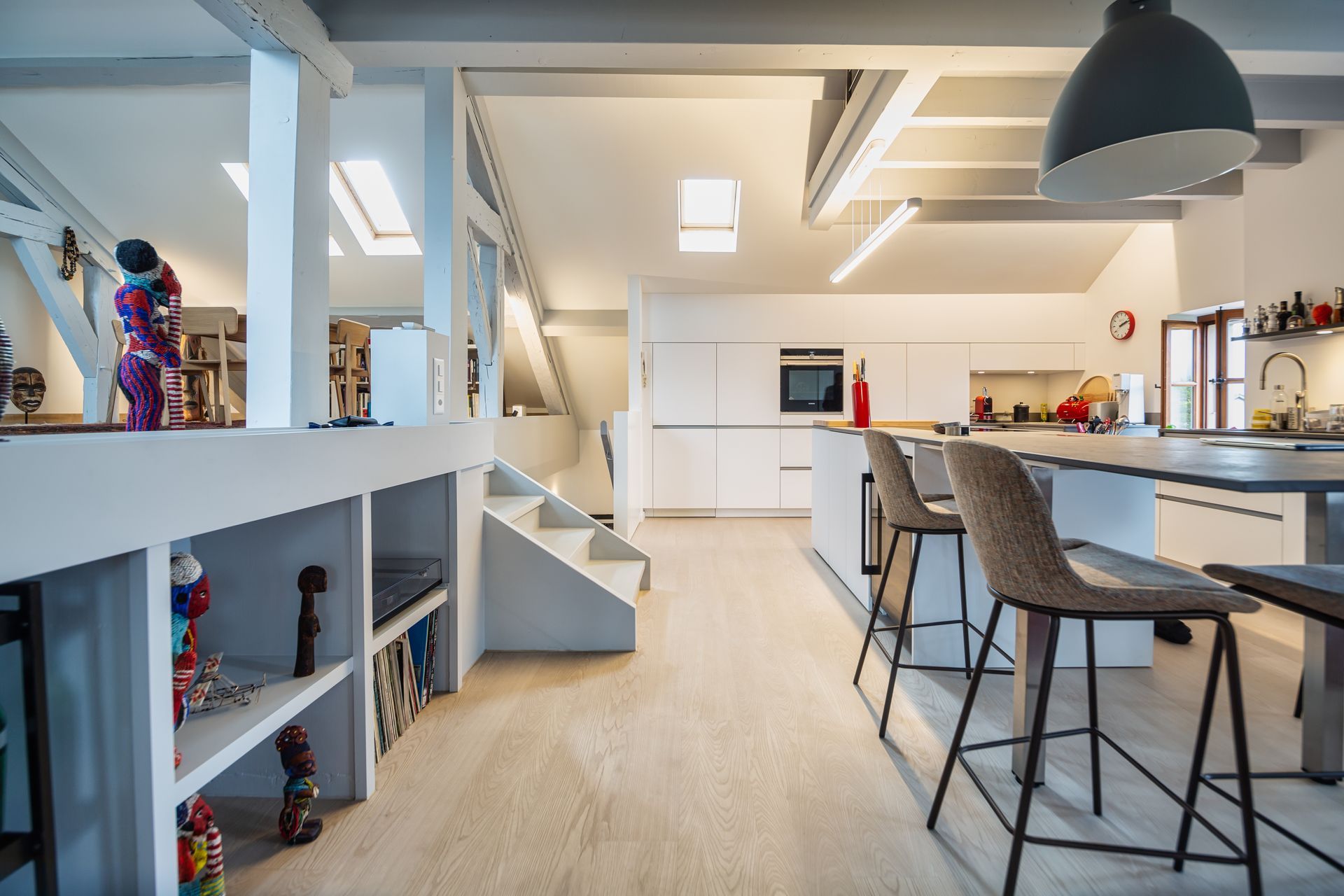 A kitchen with a table and chairs in it