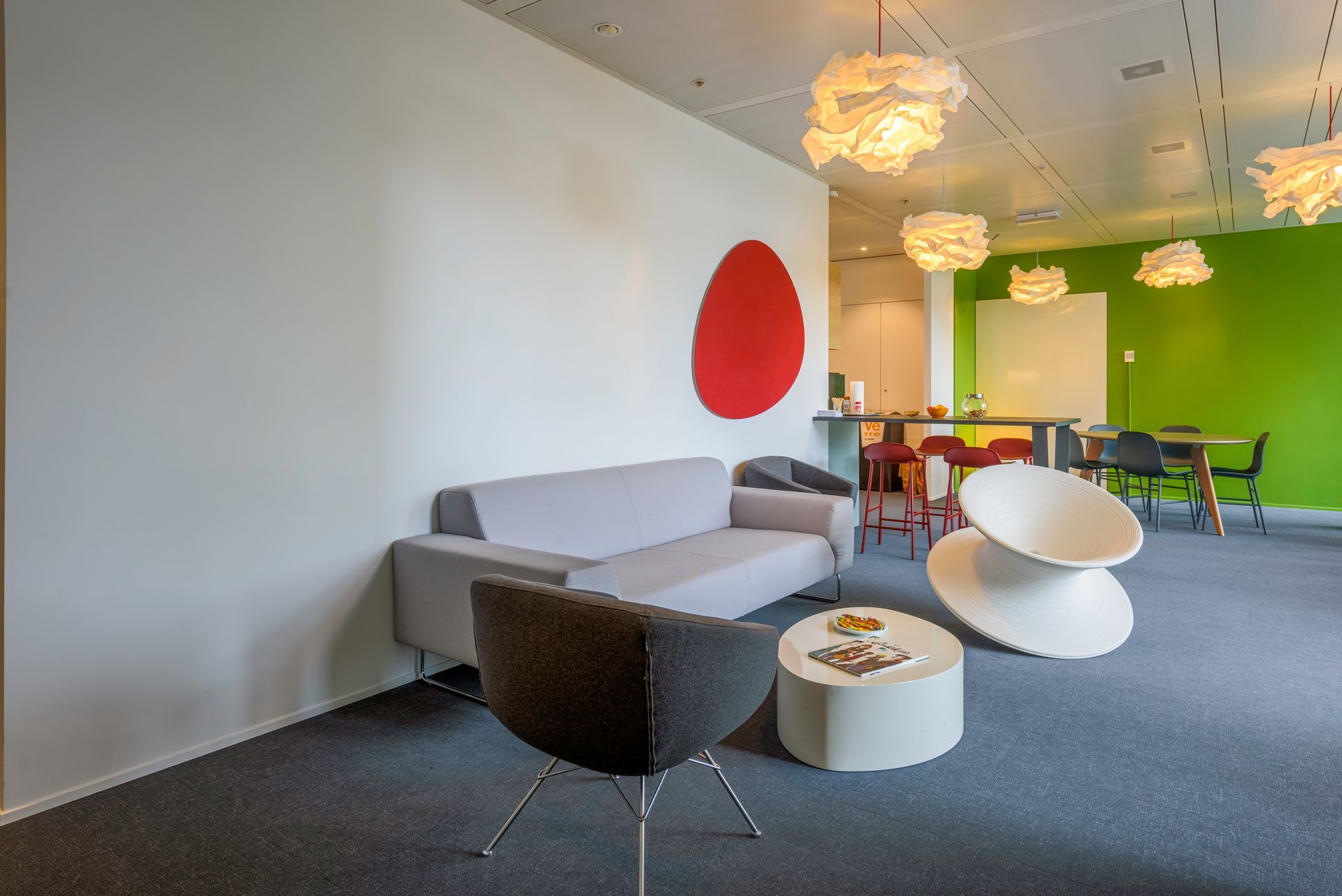 A living room with a couch and chairs and a table
