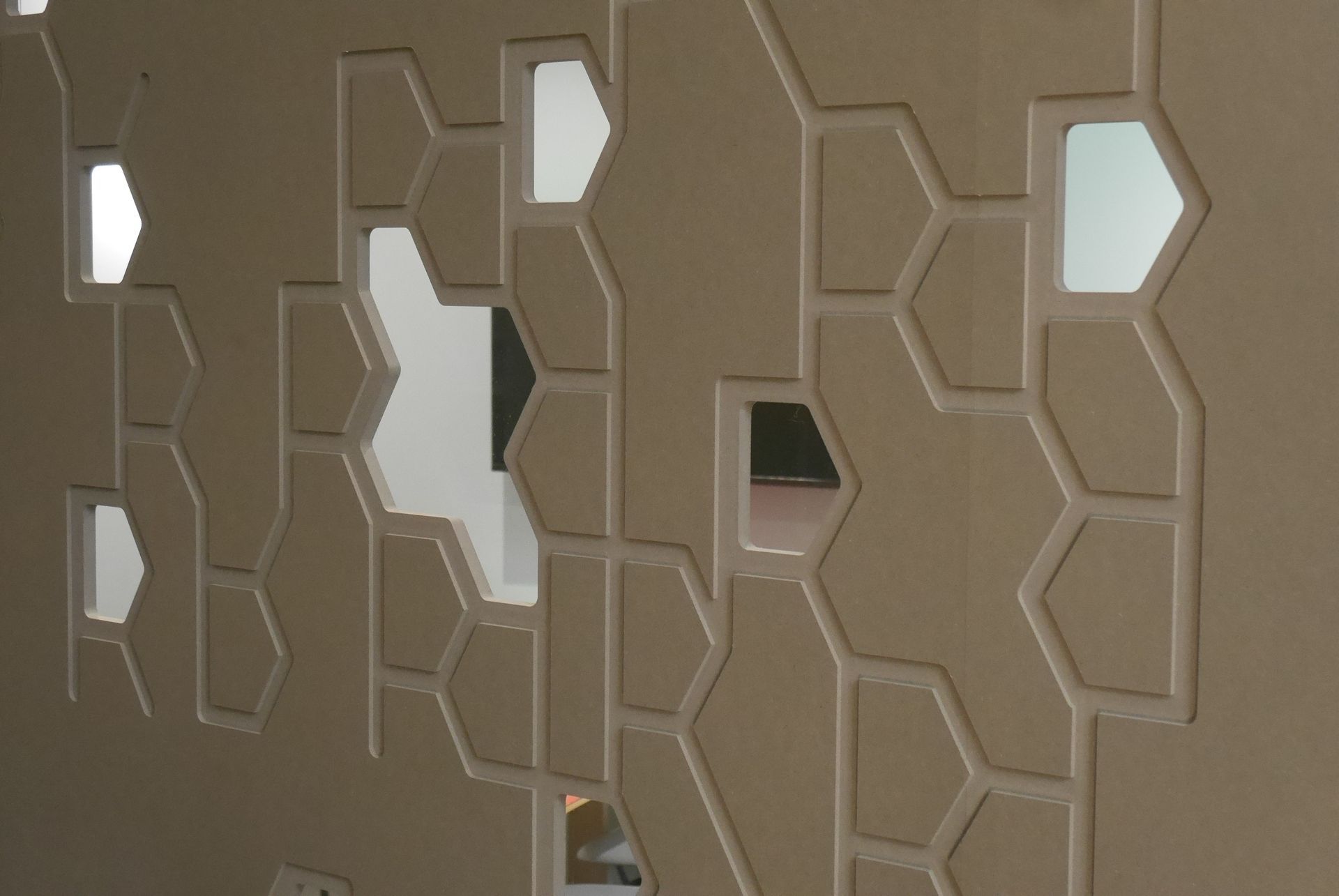 A wall with holes in it that look like honeycombs